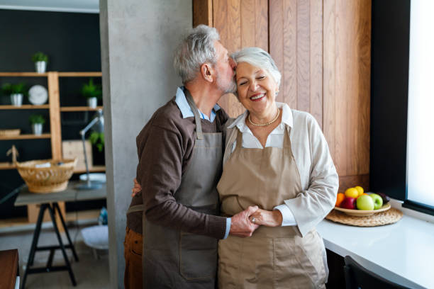 istock Happy senior couple communicating while having fun in the kitchen together 2170807046