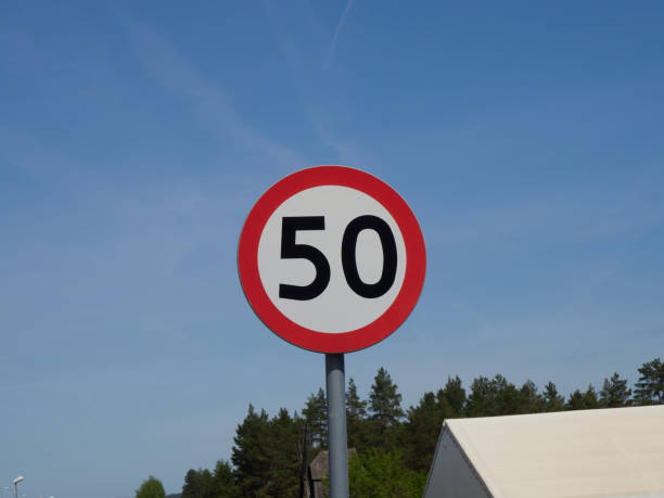 istock Traffic sign speed limit 50 kilometers per hour on the road. 2170807657