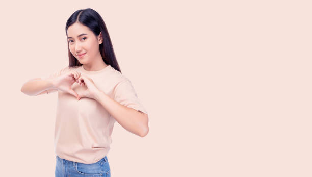 istock Woman Making Heart Gesture with Hands 2170811380