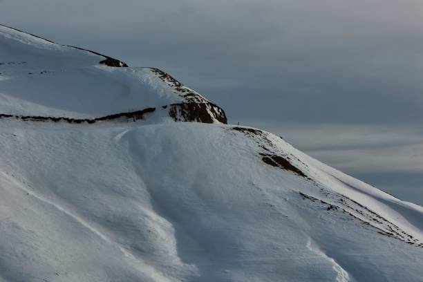 A serene snow-covered mountain peak with a cloudy sky in Trabzon, Turkey