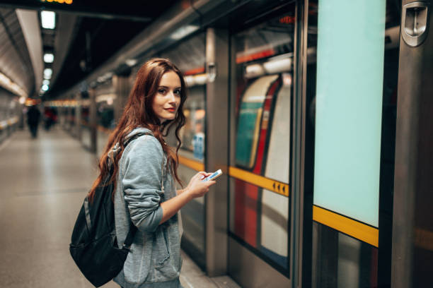 istock young woman using social media waiting the metro train 2170815229