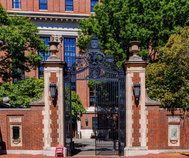 Cambridge, Massachusetts, USA - September 3, 2024:  The Class of 1877 Gate (aka the Morgan Gate) leading to the Widener Library building in Harvard University's Harvard Yard. Edwin Denison Morgan III '77 was the primary benefactor. The Harry Elkins Widener Memorial Library, housing some 3.5 million books in its stacks, is the center­piece of the Harvard College Libraries.