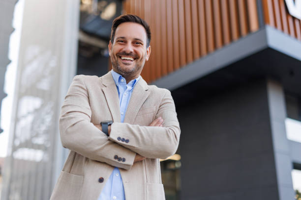 istock Man smiling with arms crossed, exuding confidence. 2170817670