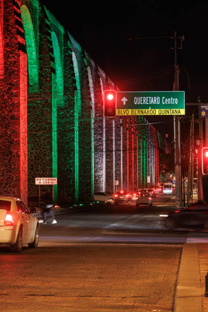 istock Aqueduct arches illuminated with Mexican patriotic colors 2170817819