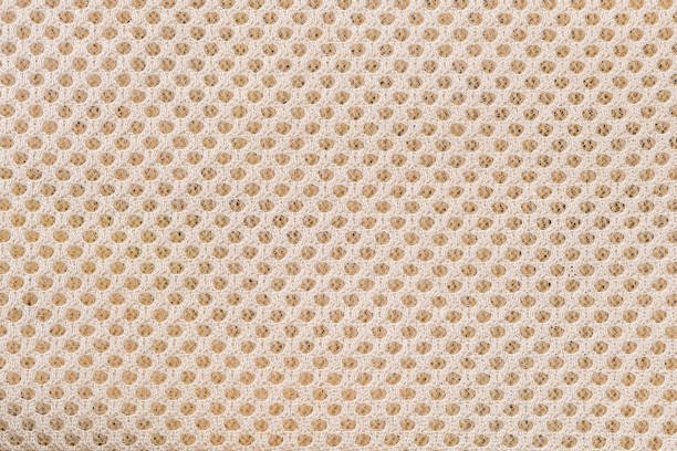 Top view closeup texture of brown  mesh laundry bag background. Mesh laundry bag using to protect delicate fabric in machine washing.
