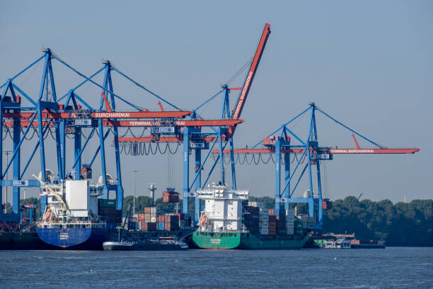 Hamburg, Germany - 09 05 2024: View of two container ships in the port of Hamburg at the Burchardkai terminal