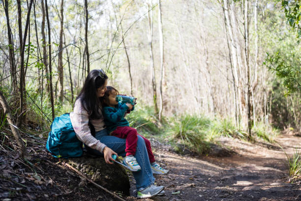 istock mother and son exploring nature together 2170828159