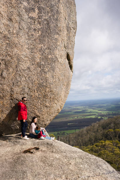 istock asian family resting  under a large boulder 2170828300