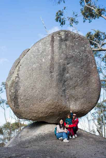 istock asian family resting  under a large boulder 2170828368