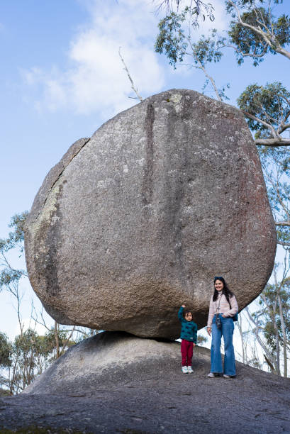 istock asian family resting  under a large boulder 2170828377