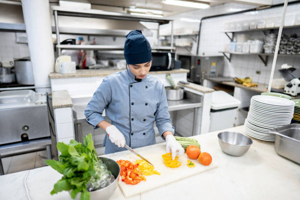 istock Chef chopping vegetables in a commercial kitchen 2170829278