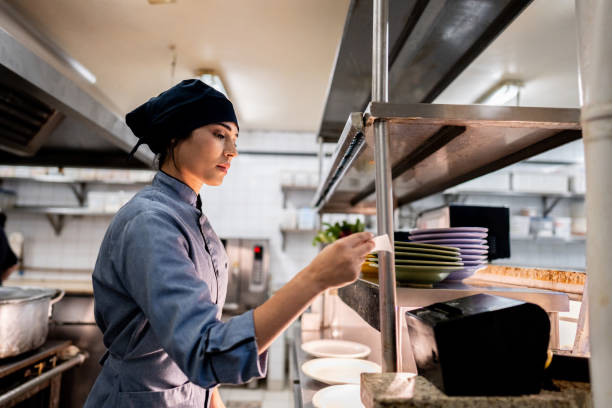 istock Chef reading order in a commercial kitchen 2170829806