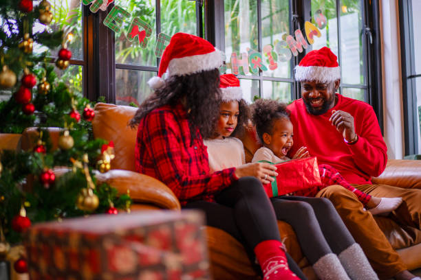 istock Family decorate Christmas tree at home. 2170830632