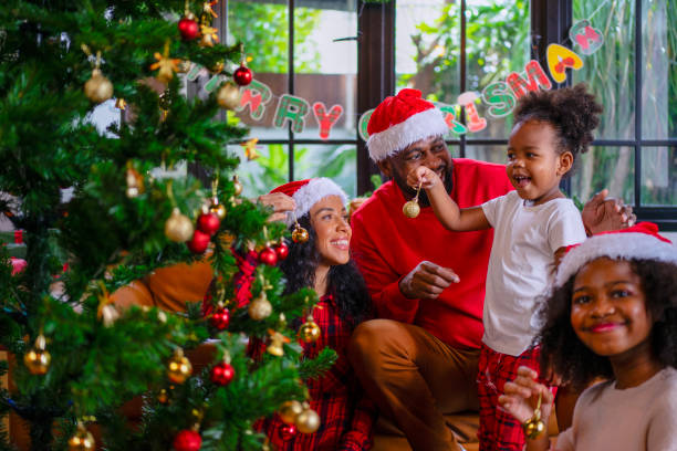 istock Family decorate Christmas tree at home. 2170830649