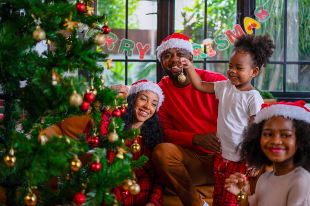 istock Family decorate Christmas tree at home. 2170830657