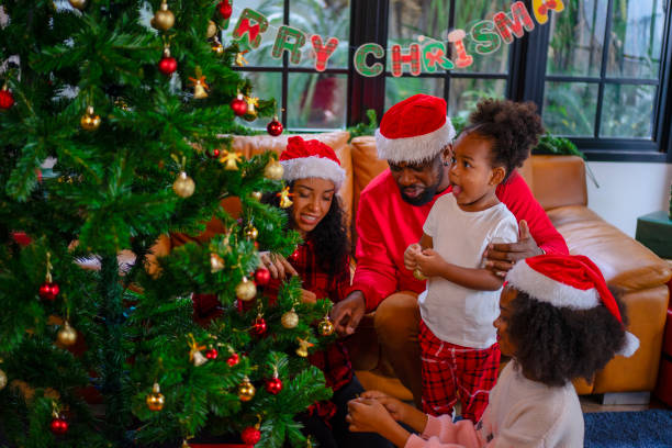 istock Family decorate Christmas tree at home. 2170830659