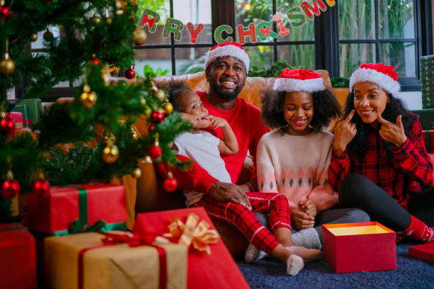 istock Family decorate Christmas tree at home. 2170830675