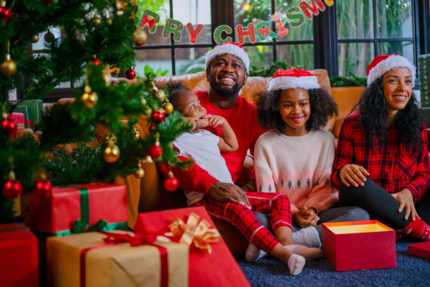 istock Family decorate Christmas tree at home. 2170830680
