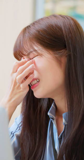 istock woman tired eye uncomfortable 2170833115