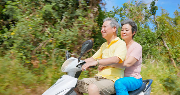 istock elder couple ride motorcycle happy 2170833536