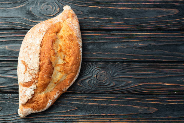 Loaf of  wheat hearth bread . Top view