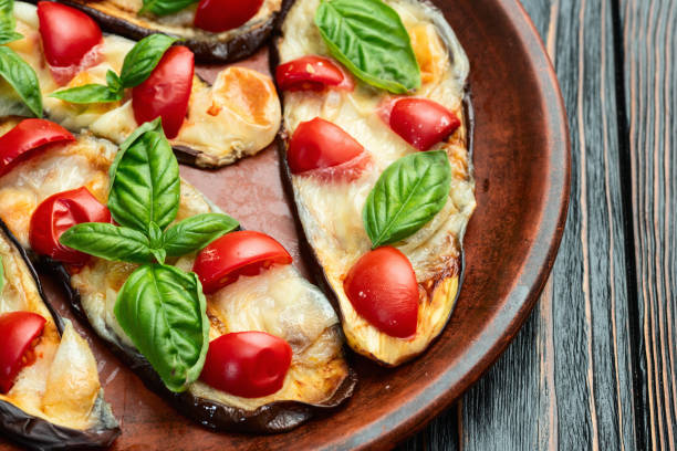 istock Italian mini pizza . Aubergine (eggplant ) with mozzarella cheese and basil . On rustic background 2170833807
