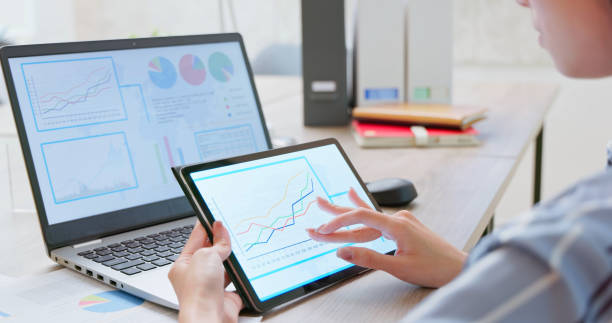 istock businesswoman laptop tablet working 2170834698
