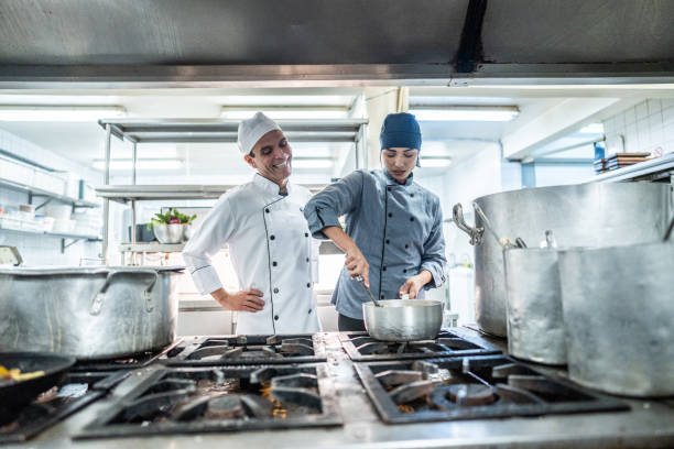 istock Chefs talking with employee while cooking a commercial kitchen 2170834934
