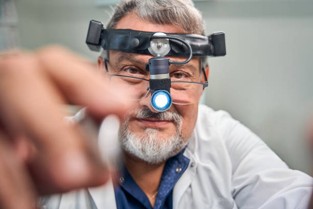 istock Doctor adjusting medical headlamp for eye examination 2170836490