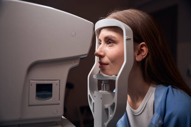 istock Female patient positioned for an eye scan examination 2170836713
