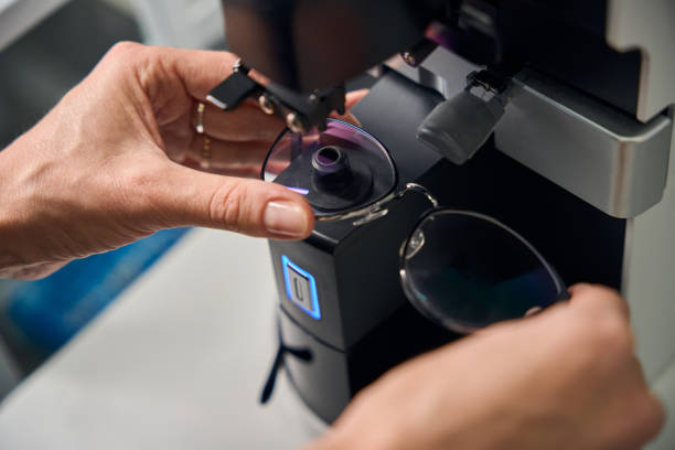 istock Optician adjusting glasses in a measuring device 2170836743