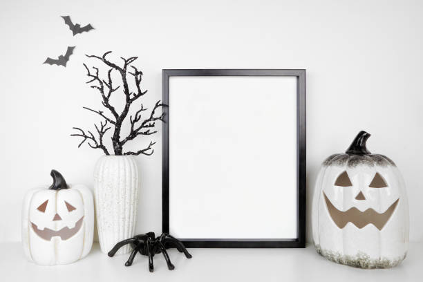 istock Halloween mock up black frame on a white shelf with jack o lanterns and black branch decor 2170838709