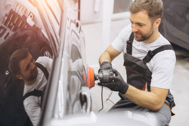 istock Professional Car Detailing with an Auto Polisher in a Garage Setting 2170840362