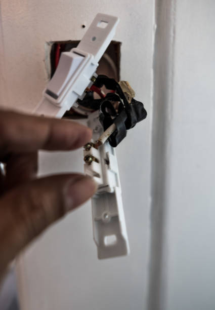 istock White Wooden Electric Light Switches 2170844987