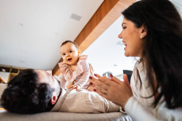 istock Parents talking and playing with their daughter at home 2170846410