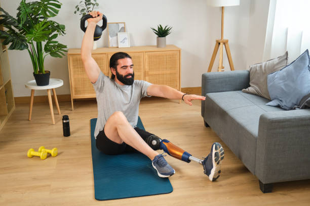 istock Amputee athlete lifting kettlebell while working out at home 2170846529