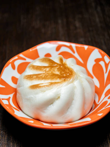 istock Golden Crispy Shengjian Bao on a ceramic plate 2170847438