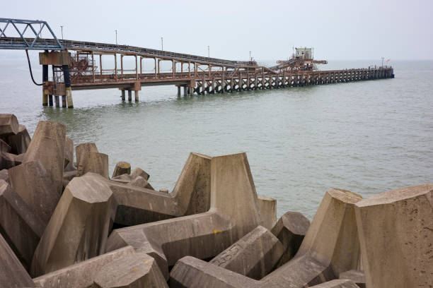 olwyn Bay, Wales, UK, 09-07-2024: Industrial pier for loading ships with gravel and stones