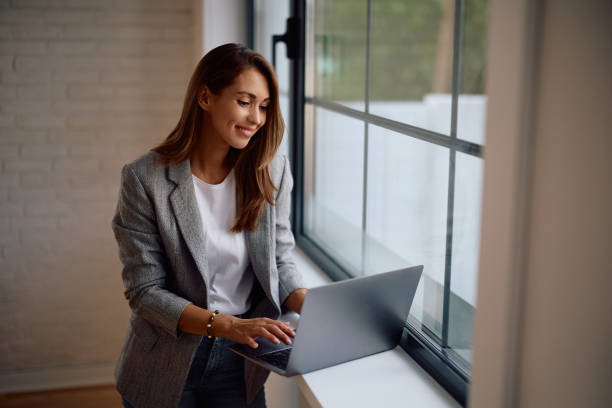 istock Young happy businesswoman using computer while working in the office. 2170849435