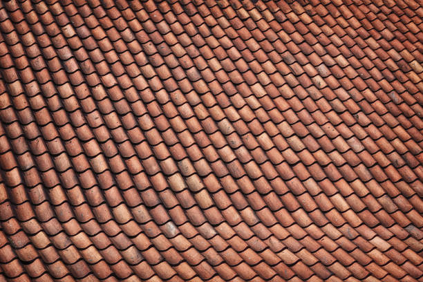 Old brown tiles on the roof.