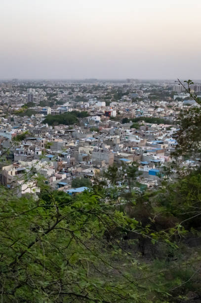 istock Crowded City view with concrete dense houses from Mountain Peak at Dusk 2170851294