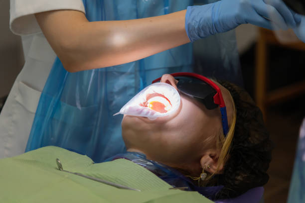 istock female patient with cheek retractor 2170852229