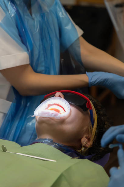 istock female patient with cheek retractor 2170852232