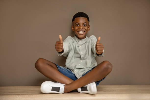 istock Beautiful young black boy posing for studio portrait 2170852834