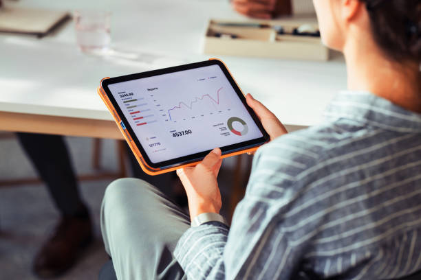 istock Businesswoman Analyzing Financial Reports on Digital Tablet 2170854824