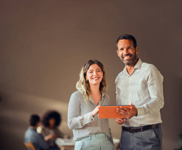 Smiling Business Colleagues Working Together in a Modern Office