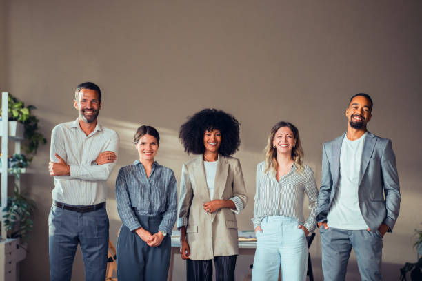 istock Diverse Group of Professionals Smiling in Office Setting 2170854846