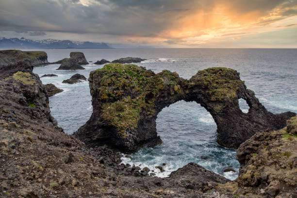istock Arnarstapi Iceland. Wild coastal cliffs, view from above with bird colonies on cliff tops and islands 2170855687