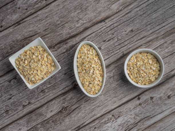Bowls of whole grain oat flakes