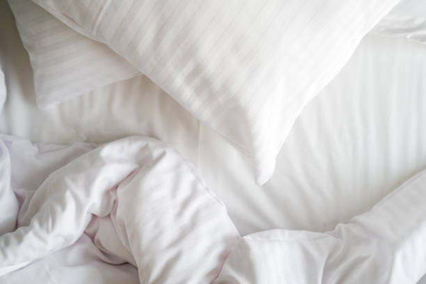 White bed with large pillows